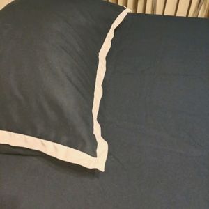 Navy blue/white trim comforter + pillow
